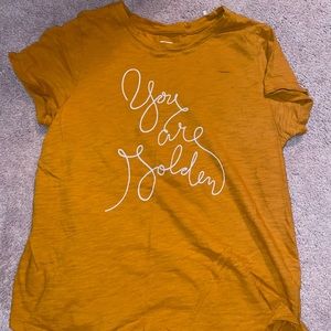 gold/orange t-shirt with writing